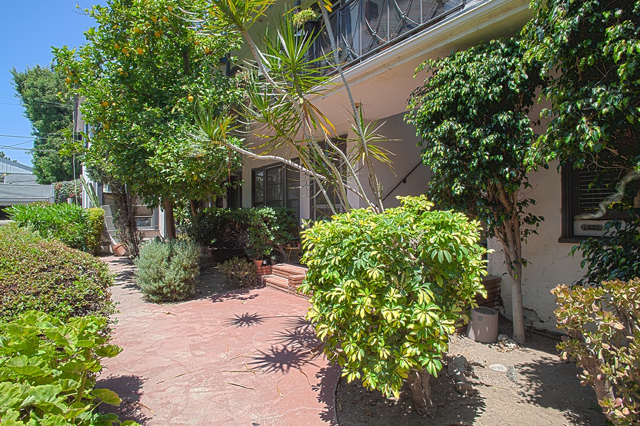 Landscaped courtyard and common walkway at a Los Angeles property